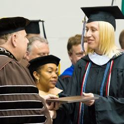 Pictured_Ellen_Kibbe_receiving_diploma_BuzzyFund